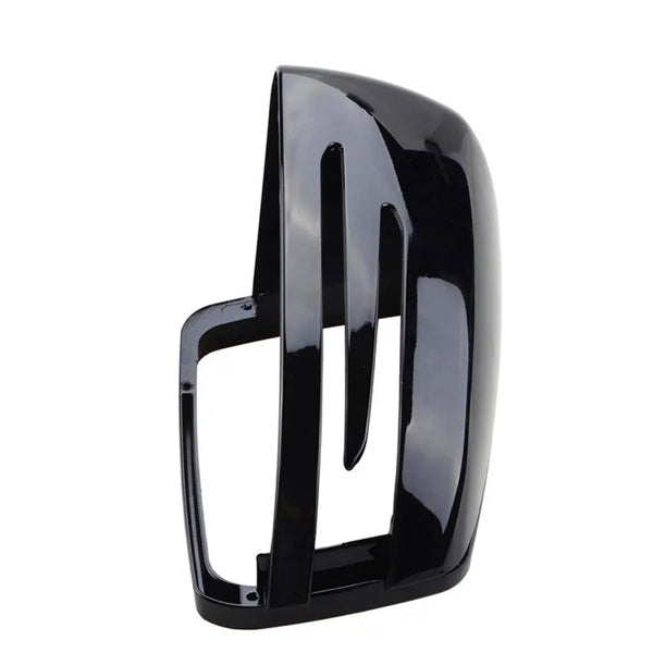 The object is a black, glossy car side mirror cover with three vertical slits, shown on a white background, highlighting its sleek design and aerodynamic features.