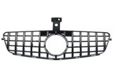 A black car grille with a rectangular grid pattern and central circular opening, positioned horizontally on a white background.