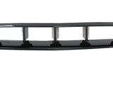 A black car grille features rectangular air vents, resting stationary against a plain white background, highlighting its sleek, aerodynamic design.