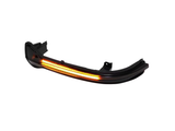 A curved automotive light with glowing amber LED strips is isolated against a white background, suggesting use as a vehicle turn signal or indicator.