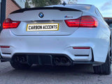 A white BMW M4 displays illuminated red taillights. The license plate reads 