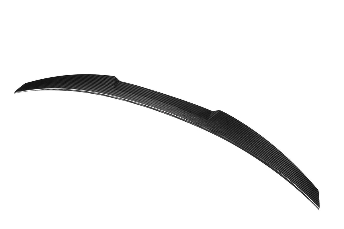 Curved carbon fiber car spoiler, sleek and aerodynamic, set against a plain white background.
