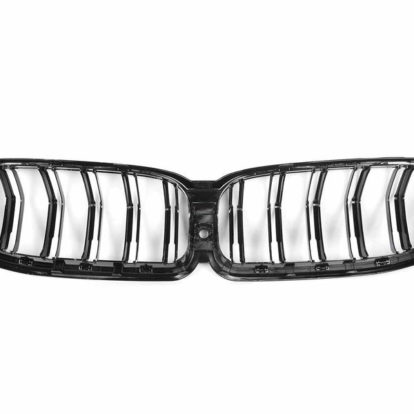 A black, double kidney-shaped car grille with vertical slats is displayed against a white background, showcasing its sleek, glossy design typically used in vehicle fronts.