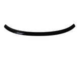 A glossy, black, curved plastic or metal strip shown on a plain white background, resembling a car spoiler or trim piece.