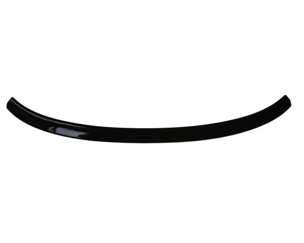 A glossy, black, curved plastic or metal strip shown on a plain white background, resembling a car spoiler or trim piece.