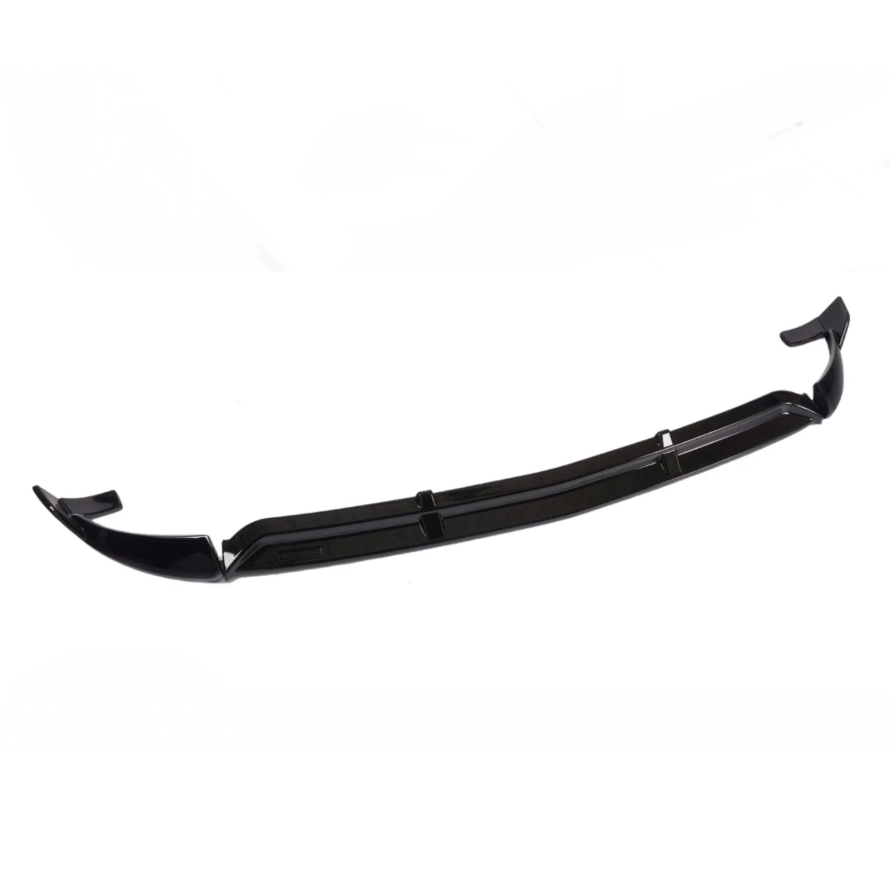 A black front lip spoiler, designed for automotive use, is displayed on a plain white background. It features aerodynamic contours with upward-curved edges, suggesting it is for enhancing vehicle aerodynamics.