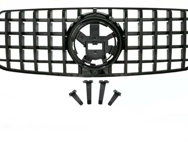 A black vehicle grille with a lattice design includes four mounting brackets below. The grille features a central circular emblem space, set against a plain background.