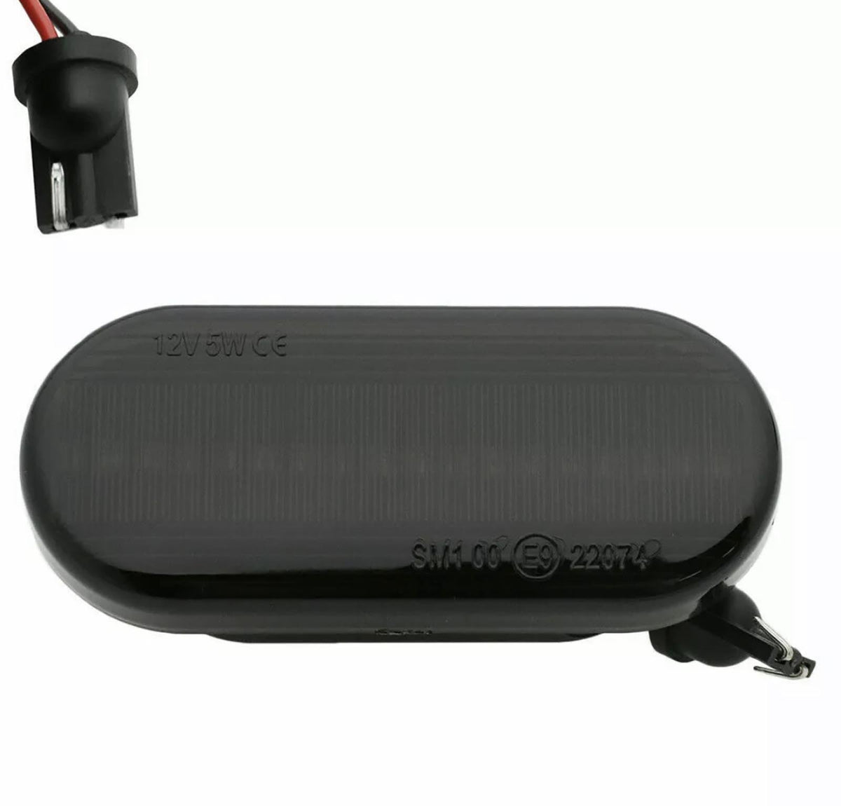 An oval black car side marker light labeled "12V5W CE SM1 06 (E9) 22974," with a socket and exposed wiring, set against a plain background.