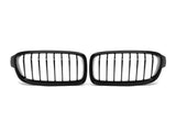 A pair of black, vertical-bar car grilles is placed on a plain white background, positioned side by side.
