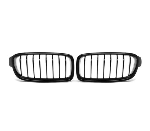 A pair of black, vertical-bar car grilles is placed on a plain white background, positioned side by side.