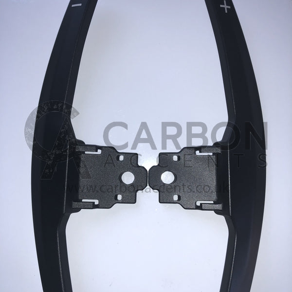 Paddle shifters with plus and minus symbols are displayed against a white background. The text reads, "CARBON ANCENTS www.carbonacents.co.uk."