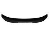 A black, curved car spoiler lies horizontally against a white background, showcasing its aerodynamic design intended for vehicle rear installation.
