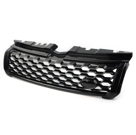 A black, honeycomb-patterned car grille with a central oval emblem space, designed for vehicle front placement. The grille is set against a plain white background.