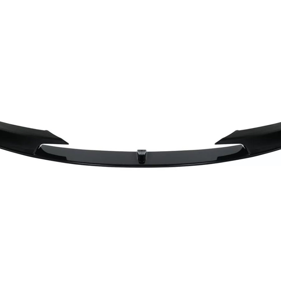 Black car front splitter with a glossy finish, featuring aerodynamic fins on both sides. It is isolated against a plain white background.