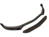 A black car front splitter lies against a white background, consisting of two separate aerodynamic pieces designed to improve vehicle stability and reduce drag.