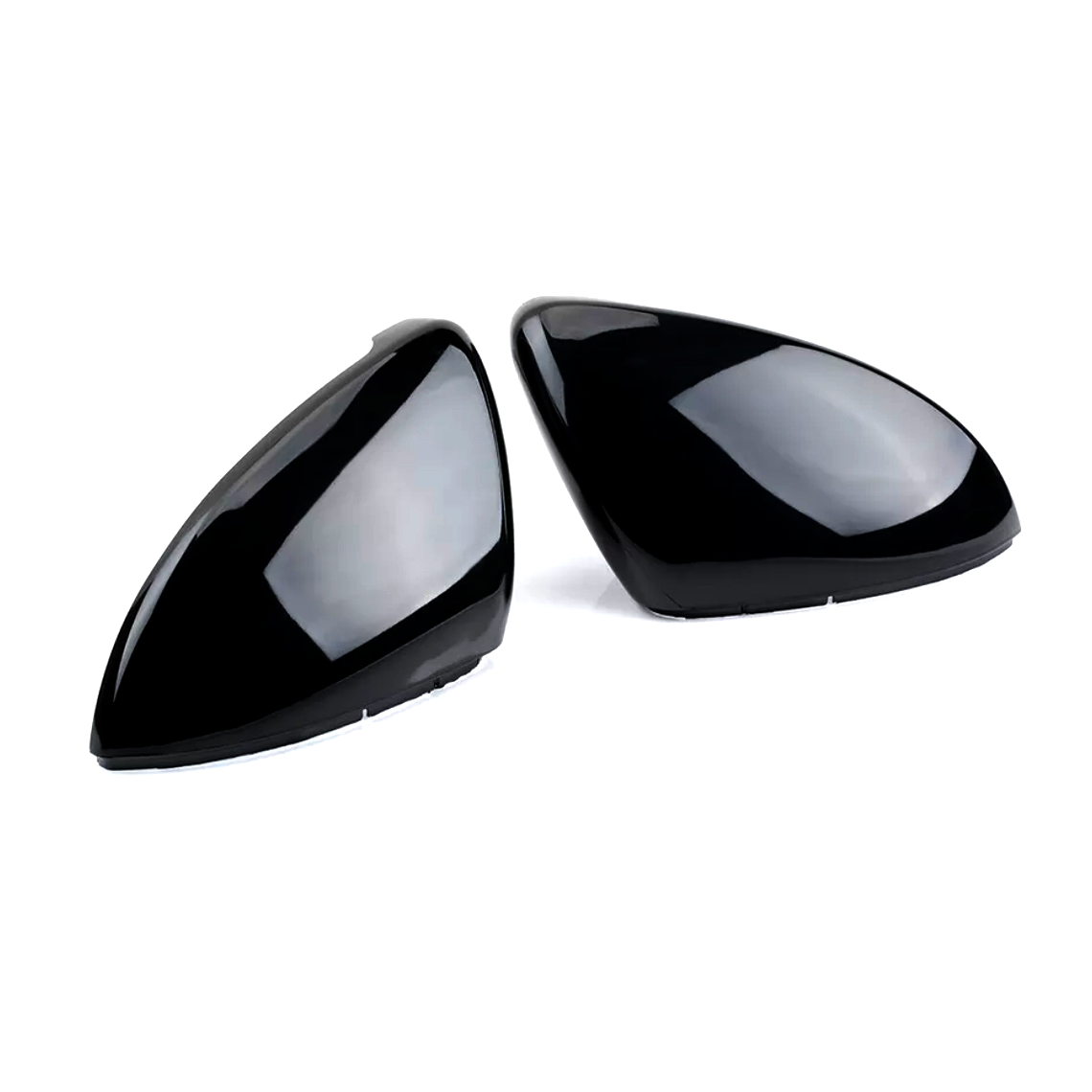 Two shiny black car mirror covers are lying side by side on a plain white background, reflecting light softly across their smooth, contoured surfaces.