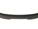 A sleek, black car spoiler with a curved design rests against a plain white background, emphasizing its aerodynamic shape and glossy finish.