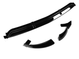 A black car spoiler and two side attachments are placed on a white background, highlighting their sleek, glossy finish and aerodynamic design.