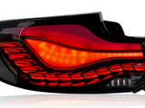 Tail light emits red and orange glow, featuring layered design with intricate patterns. Context shows a labeled blue 
