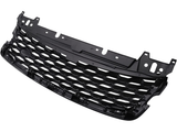 A black car grille with a honeycomb pattern, made of plastic, is shown from an angled perspective against a plain white background.