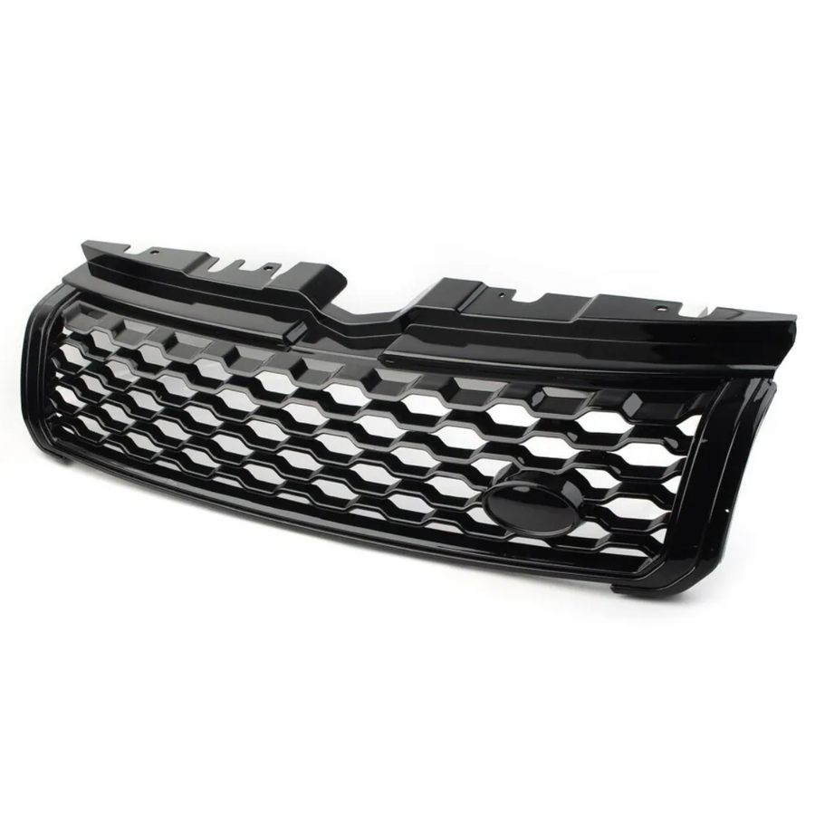 Black car grille with a honeycomb pattern, resting on a plain white surface, featuring a central oval space likely for logo placement, designed for front vehicle installation.