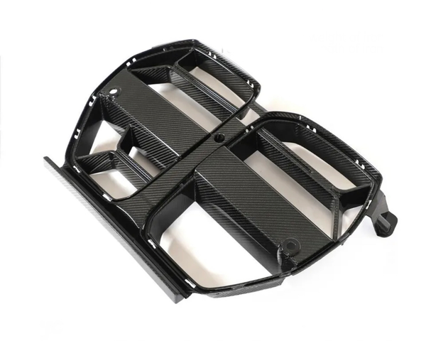 A carbon fiber car grille with a rectangular pattern lies on a white background, displaying its sleek, lightweight design.