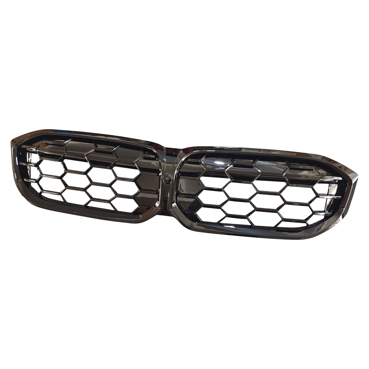 A black, dual-section car grille with a hexagonal mesh design is positioned against a plain white background.