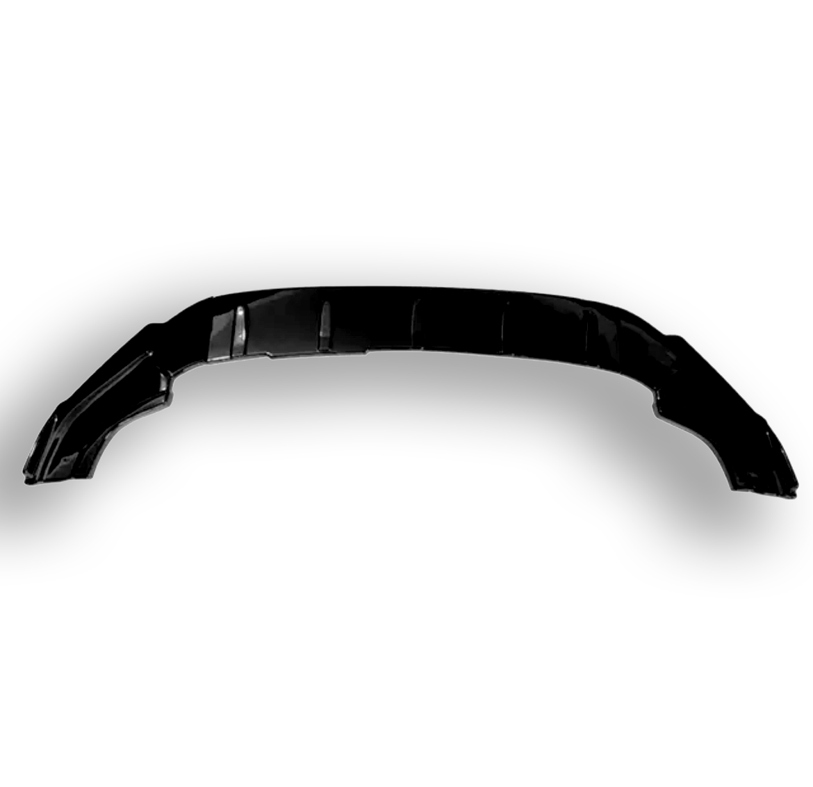 A black automotive bumper is resting on a plain white background, displaying curved edges and subtle detailing across its surface.