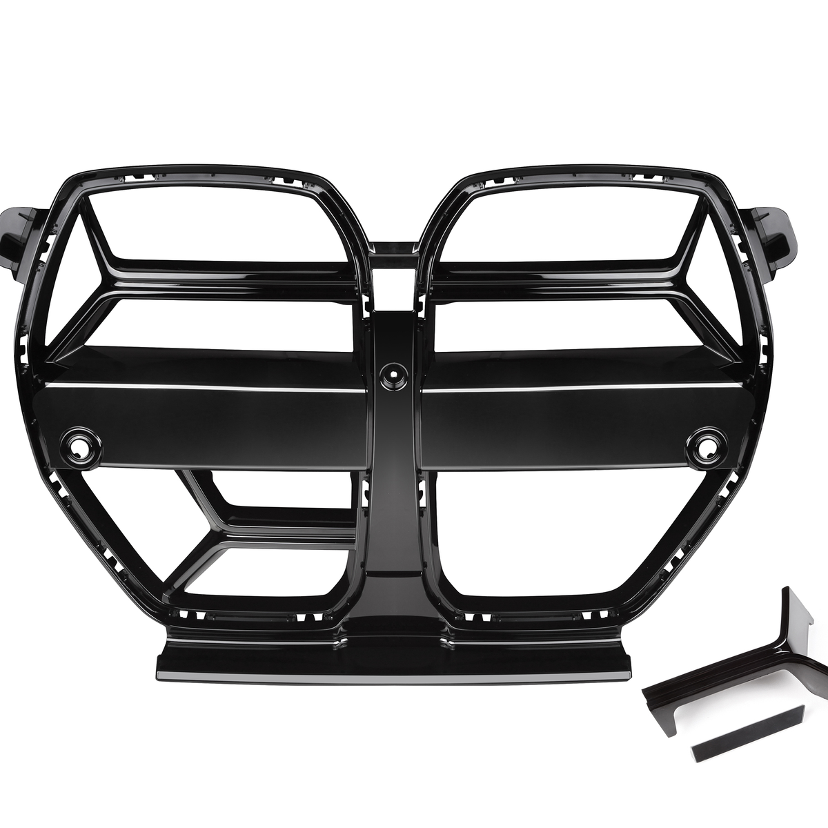 A glossy black car grille with a segmented design rests on a white background, featuring dual openings and two separate black trim pieces nearby.