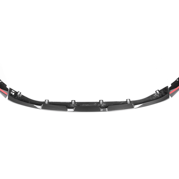 Carbon fiber car front splitter with aerodynamic design, featuring red accents and mounting points. It is placed against a plain white background.