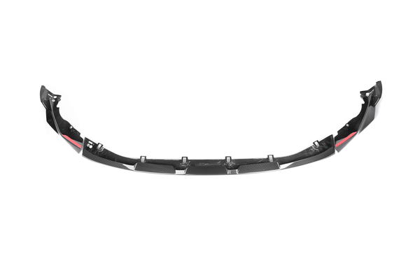 Carbon fiber car front splitter with aerodynamic design, featuring red accents and mounting points. It is placed against a plain white background.