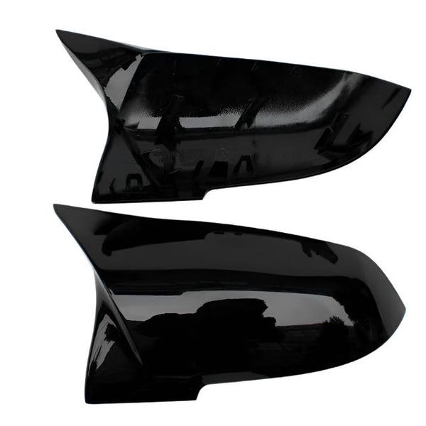 Two black, glossy car side mirror covers are displayed against a white background. The covers have a sleek, aerodynamic shape and appear unused, with no visible text or markings.
