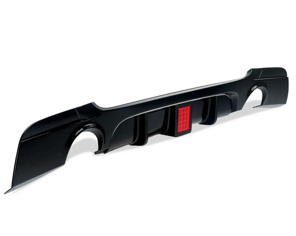 A black car rear diffuser with aerodynamic fins features a central red light, sitting isolated on a plain white background.