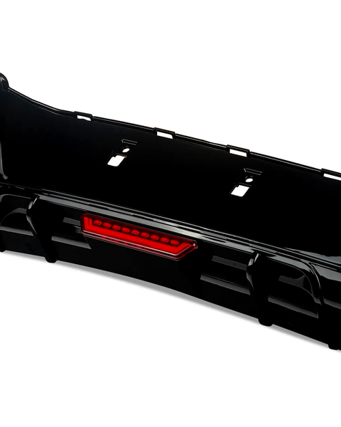 The object is a black car bumper with an integrated red reflector, resting on a white background. The design features cutouts for attachment, suitable for automotive enhancement.