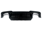 A black car bumper with integrated wiring rests on a white background, showcasing its sleek, contoured design and aerodynamic features.