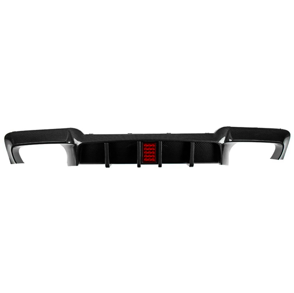 Carbon fiber car rear diffuser with integrated red light sits against a white background, showing aerodynamic fins and contoured edges designed for performance improvement in automotive applications.
