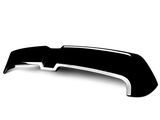 A glossy black spoiler with a sleek design rests on a plain white background, featuring a prominent central bend and chrome accents along the edges.