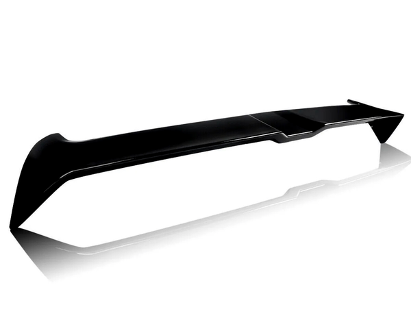 A sleek black car spoiler rests on a reflective white surface, showcasing its aerodynamic design and angled edges.
