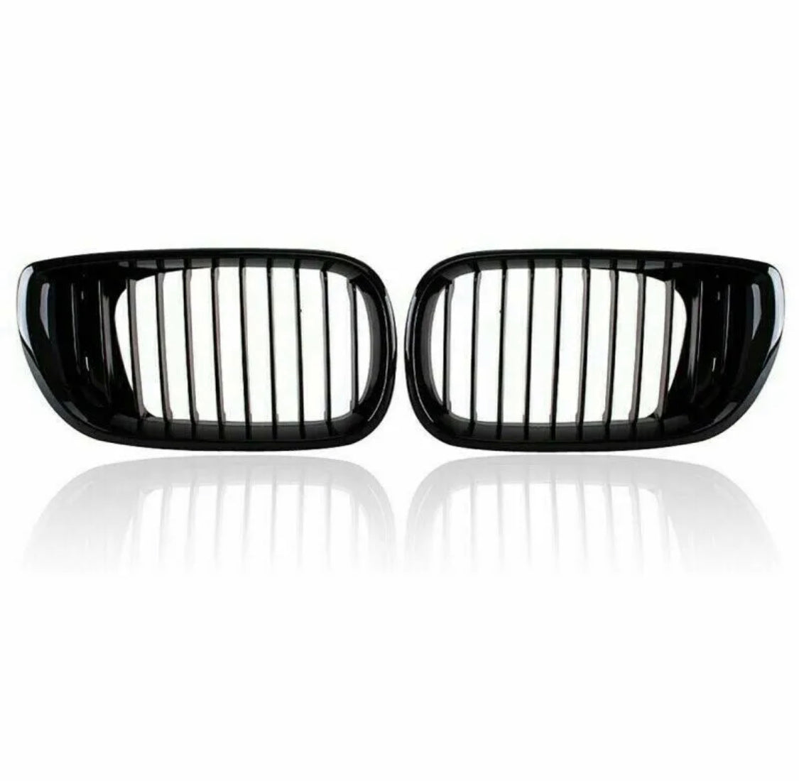 Two black car kidney grilles with vertical slats are shown against a plain white background, reflecting slightly underneath, suggesting a glossy surface.