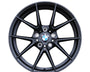 A black BMW alloy wheel features a ten-spoke design with the BMW logo at the center. "M PERFORMANCE" is embossed on the rim, set against a plain white background.