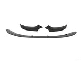 Three black car bumper parts are laid out separately on a plain white background, showing the design and contours from a top-down perspective.
