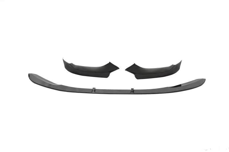 Three black car bumper parts are laid out separately on a plain white background, showing the design and contours from a top-down perspective.