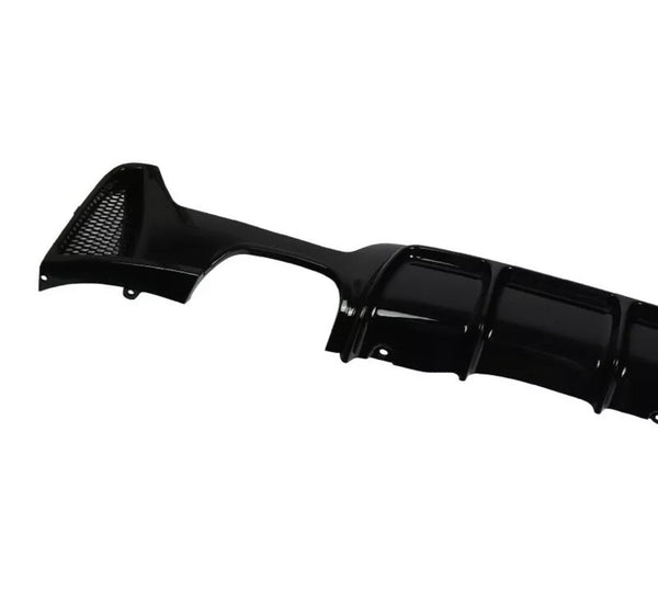 Black car bumper diffuser, featuring a glossy finish and integrated mesh vent, displayed against a white background. The design includes curved aerodynamic grooves for enhanced vehicle performance.