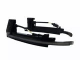 A pair of black LED car side mirror turn signal lights with attached wires rests against a plain white background.