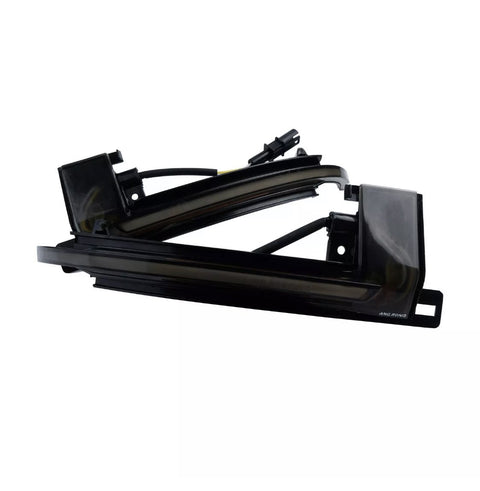 A sleek black automotive light fixture with wiring, labeled "AMG RGNG," against a white background, showcasing its angular design and curved edges.