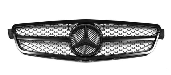 A car grille with a geometric mesh pattern surrounds a central emblem, featuring a three-pointed star, against a plain white background.