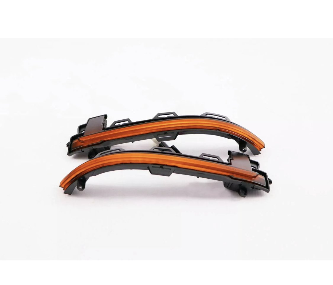 Curved LED light strips are positioned against a plain white background. The strips are embedded in black plastic casings, designed to be mounted, likely for automotive use.