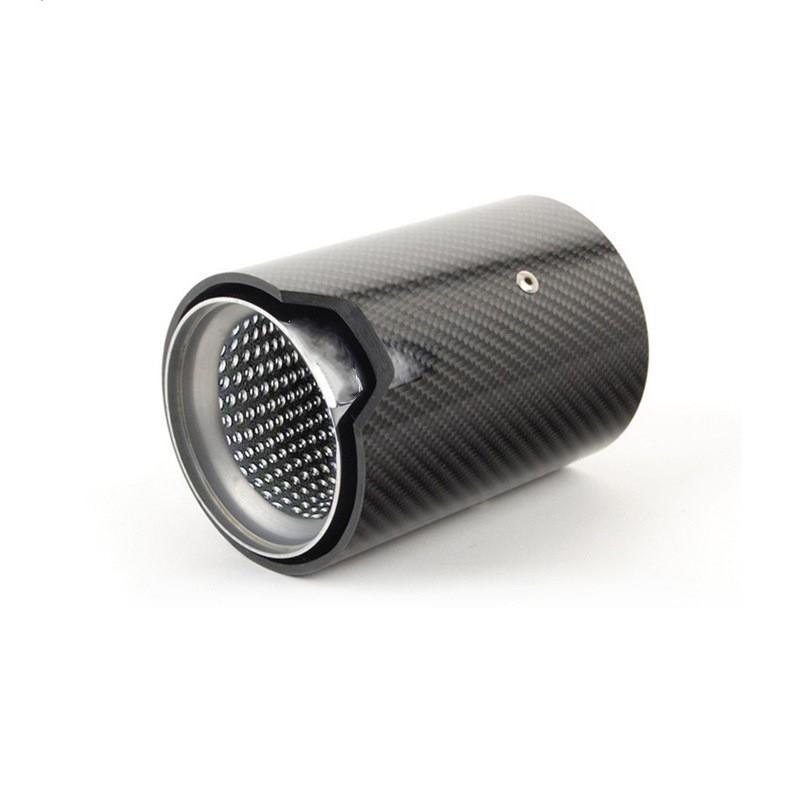 A cylindrical, carbon-fiber muffler tip with a perforated metal interior lies on its side, set against a plain white background.