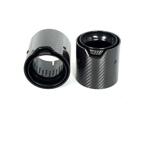 Two carbon fiber exhaust tips with a glossy finish stand upright on a white surface. Each tip features the engraved text "WILL" on a small metal plate.