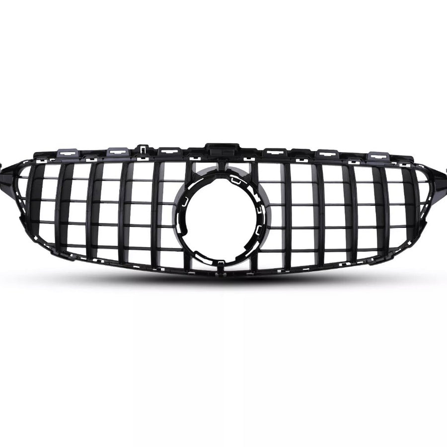 A black car grille with vertical and horizontal slats is positioned against a plain white background, featuring a central circular emblem space, suggesting automotive design.